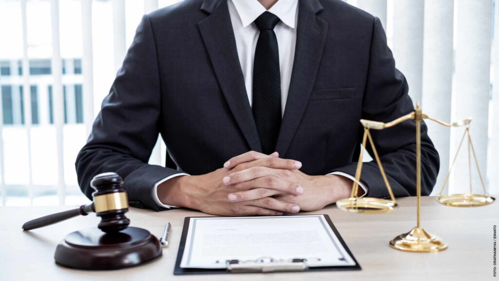 Professional male lawyers work at a law office There are scales,